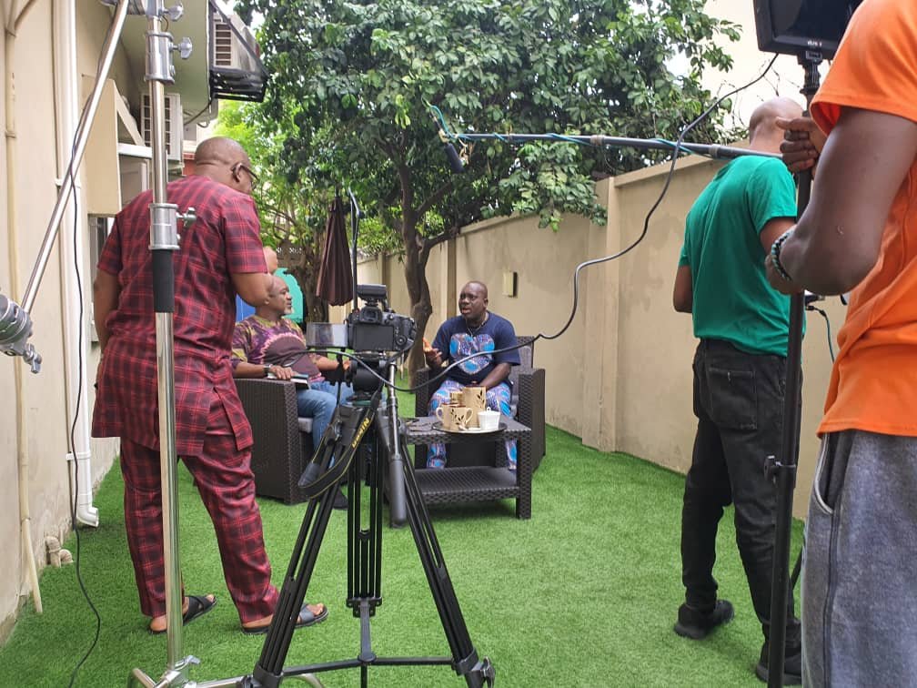 The Naijaspora Media crew filming an interview outdoors